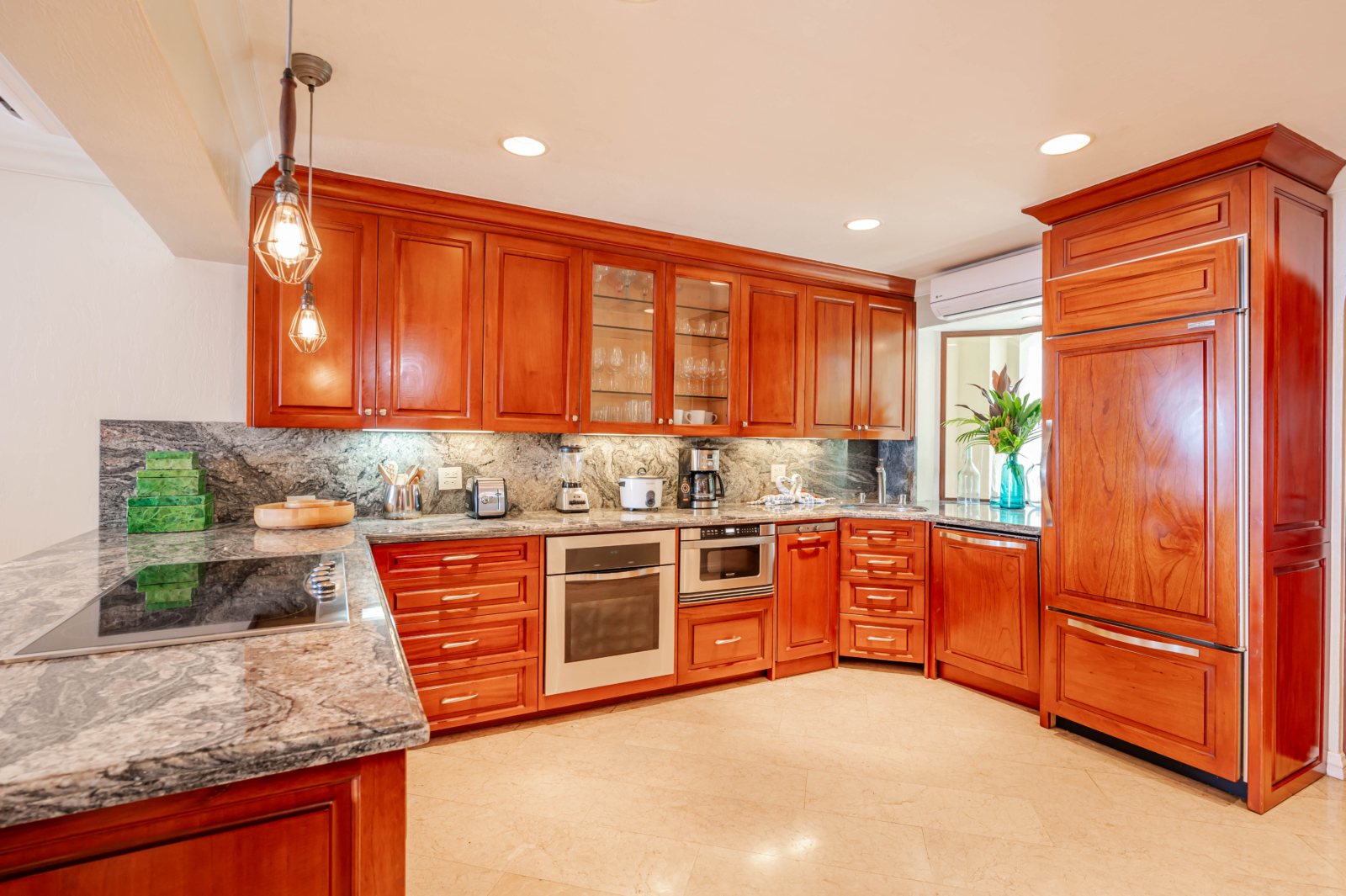 Fully equipped gourmet kitchen with wood cabinetry and granite countertops in Costa Rica villa – Charity Ace luxury stay