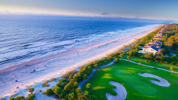Stunning aerial view of Hilton Head coastline and Palmetto Dunes oceanfront golf course at sunrise