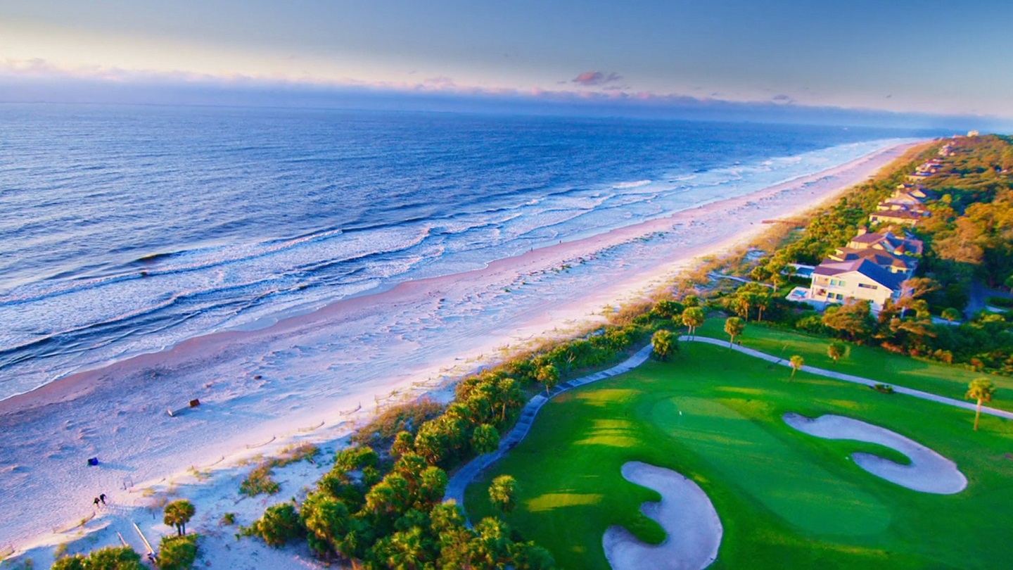 Stunning aerial view of Hilton Head coastline and Palmetto Dunes oceanfront golf course at sunrise