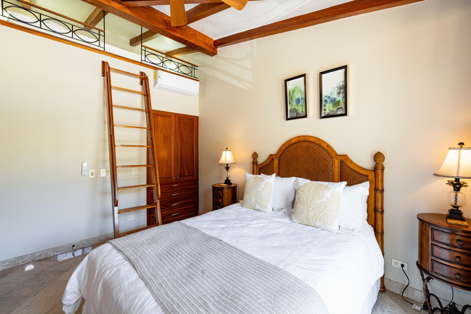 Charming bedroom with wooden loft ladder, cozy linens, and natural lighting – Charity Ace Costa Rica escape