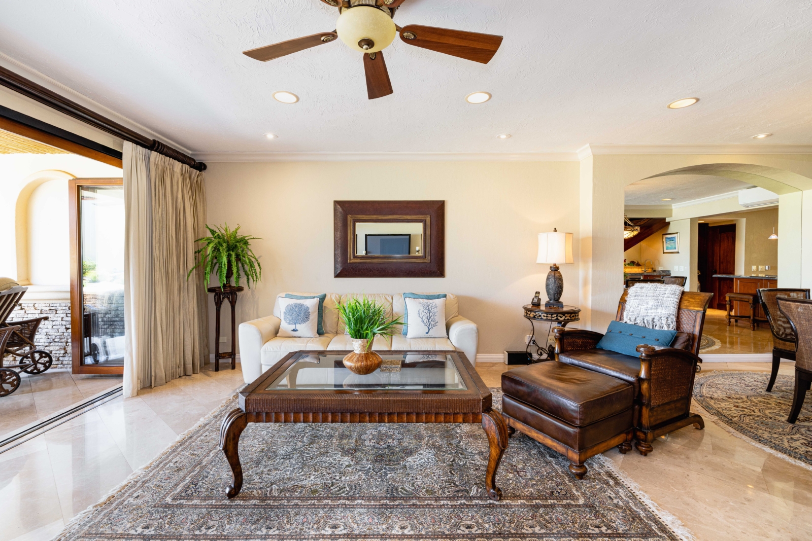 Inviting living room with elegant furnishings and open access to outdoor seating – Charity Ace luxury villa in Costa Rica